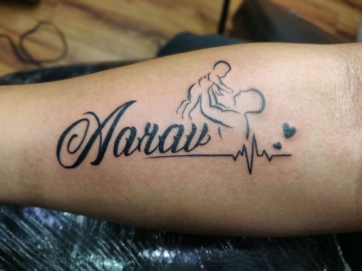 a tattoo with the word namu on it's arm and an image of a man