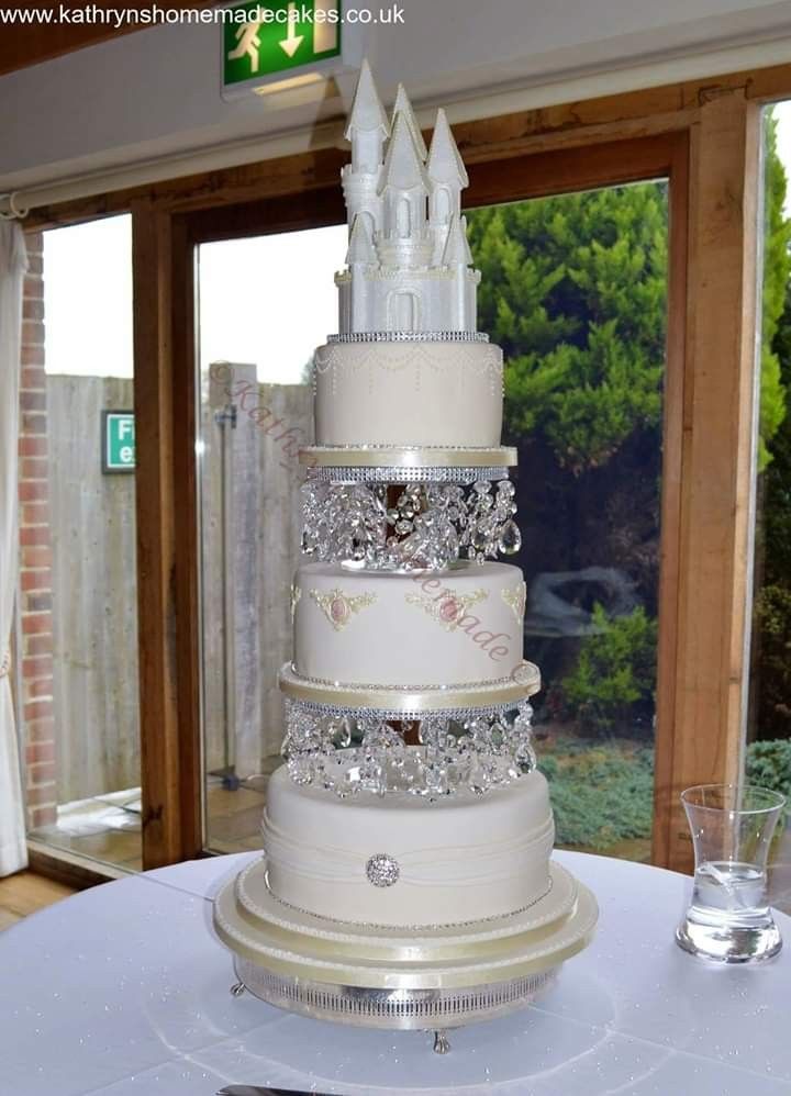 a wedding cake is sitting on top of a table