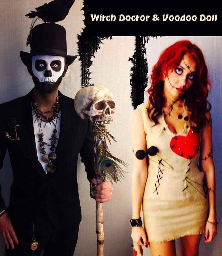 two people dressed up in halloween costumes and one is holding a stick with a skull on it