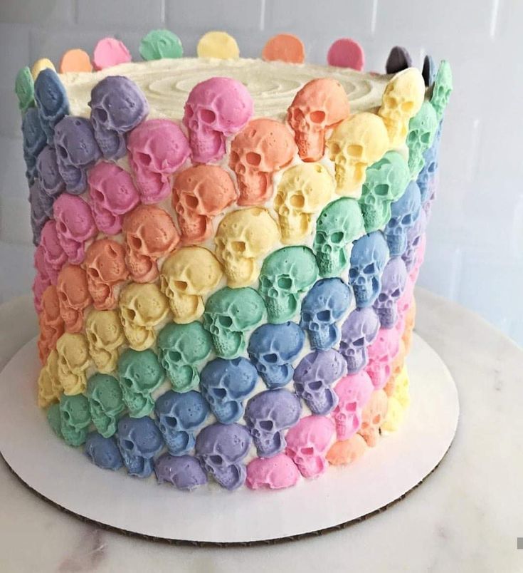 a rainbow colored cake with skulls on it