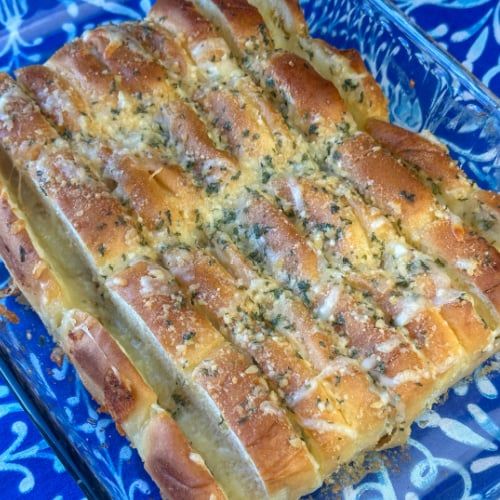 a square casserole dish on a blue plate