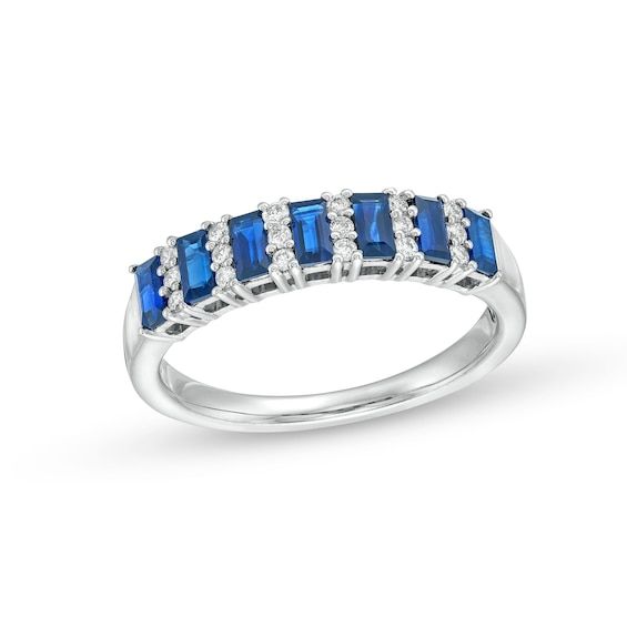 Update your look with the easy sophistication of this alternating baguette-cut blue sapphire and diamond trio band in white gold. Crafted in 14K white gold Channel-set baguette-cut bright blue sapphires alternate with linear trios of sparkling diamonds. This band shines with 1/8 ct. t.w. of diamonds. Timeless Blue Jewelry With Baguette Diamonds, Blue Sapphire Ring With Channel Set Baguette Cut, Blue Sapphire Baguette Cut Channel Set Ring, Blue Sapphire Baguette Cut Ring Channel Set, Classic Silver Sapphire Ring With Baguette Diamonds, Blue Baguette Cut Channel Set Sapphire Ring, Fine Jewelry Sapphire Ring With Baguette Diamonds, White Gold Sapphire Ring With Baguette Diamonds, Classic White Gold Sapphire Ring With Baguette Diamonds