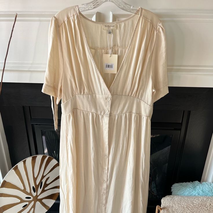 Cream Summer Midi Dress Spring Lined Midi Dress, Cream Short Sleeve Maxi Dress For Spring, Beige V-neck Lined Midi Dress, Beige V-neck Rayon Dress, Cream V-neck Dress For Day Out, Spring Date Night Rayon Dress, Spring Rayon Dress For Date Night, Summer Cream Midi Dress, Cream Midi Dress For Summer