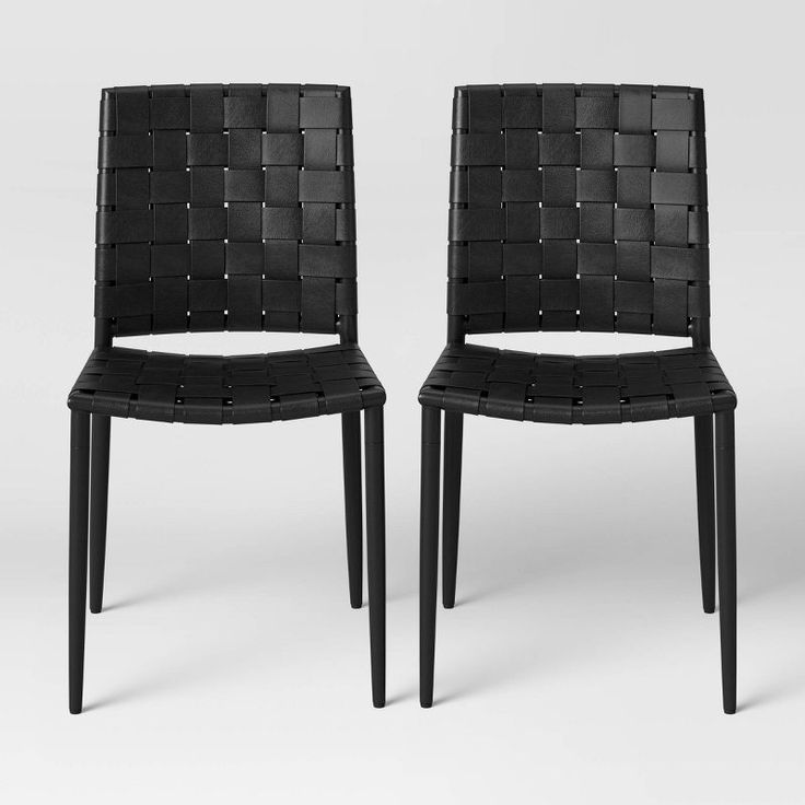 two black chairs sitting next to each other