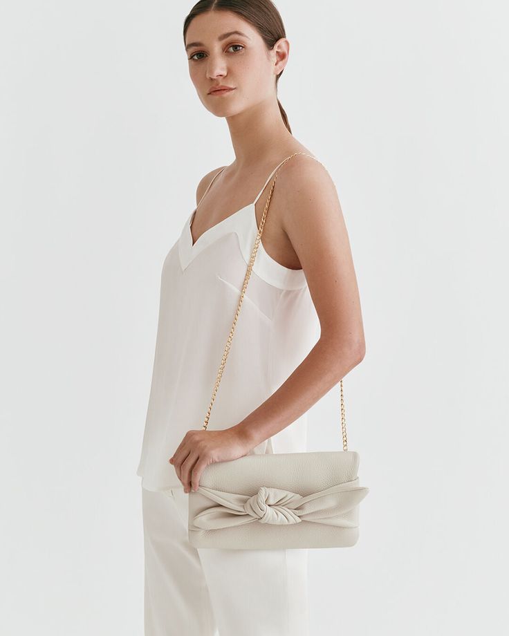 A fun finishing touch to your celebratory looks, made from luxurious Italian pebbled leather and lined in cotton twill, inspired by our bestselling Mini Bow Bag. Elegant Soft Leather Bags, Chic Summer Evening Bag For Events, Spring Evening Bags With Detachable Strap, Cream Leather Evening Bag, Elegant Summer Clutch Bag, Elegant Cream Leather Shoulder Bag, Spring Formal Leather Shoulder Bag, Elegant Soft Leather Shoulder Evening Bag, Summer Formal Leather Bags