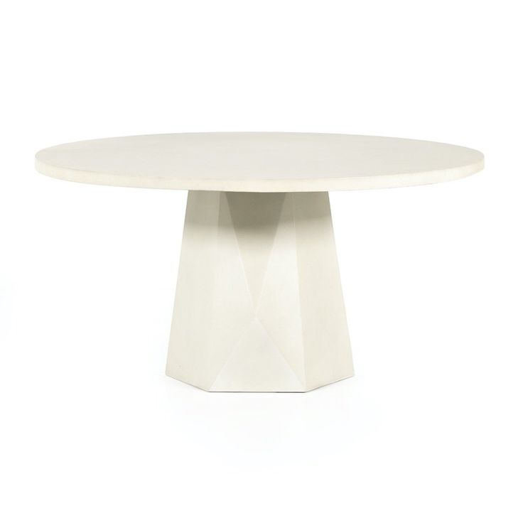 a white table with an oval shaped base on it's side, against a white background