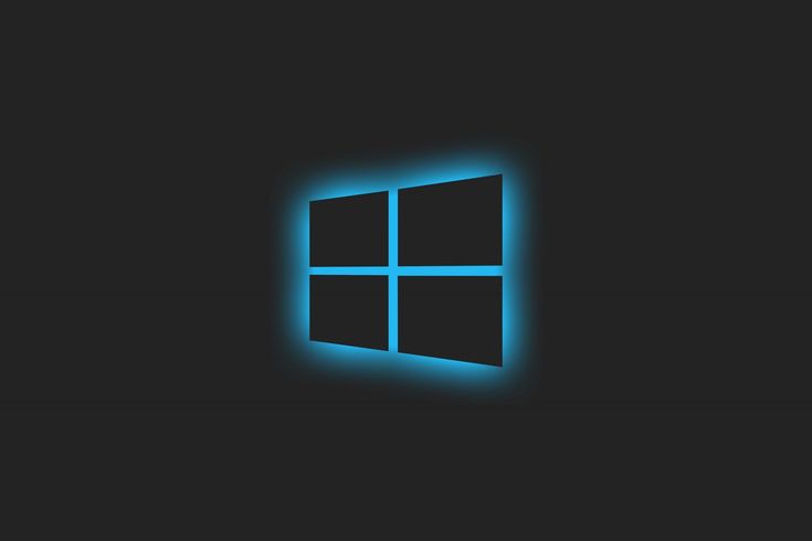 the windows logo in blue light on a black background with an image of a glowing window