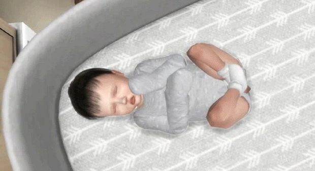 a baby is laying down in a crib with his head turned to the side