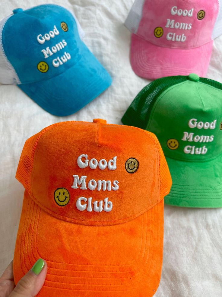 The summer version of your cap, our good moms club trucker hat has an original embroiled logo and mesh back with adjustable snap closure. Pair with your favorite swimwear or go-to style! Adjustable snap back closure Embroidered Logo patch Summer Cotton Trucker Hat, Summer Sports Trucker Hat With Curved Bill, Summer Mesh Trucker Hat With Curved Brim, Spring Sports Trucker Baseball Cap, Blue Snapback Hat With Letter Print For Summer, Summer Cotton Trucker Baseball Cap, Blue Trucker Hat With Embroidered Logo For Summer, Summer Trucker Baseball Cap In Cotton, Cotton Trucker Snapback Hat For Summer