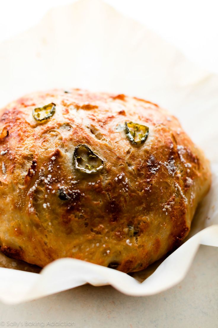 a baked item in a white bowl on a table