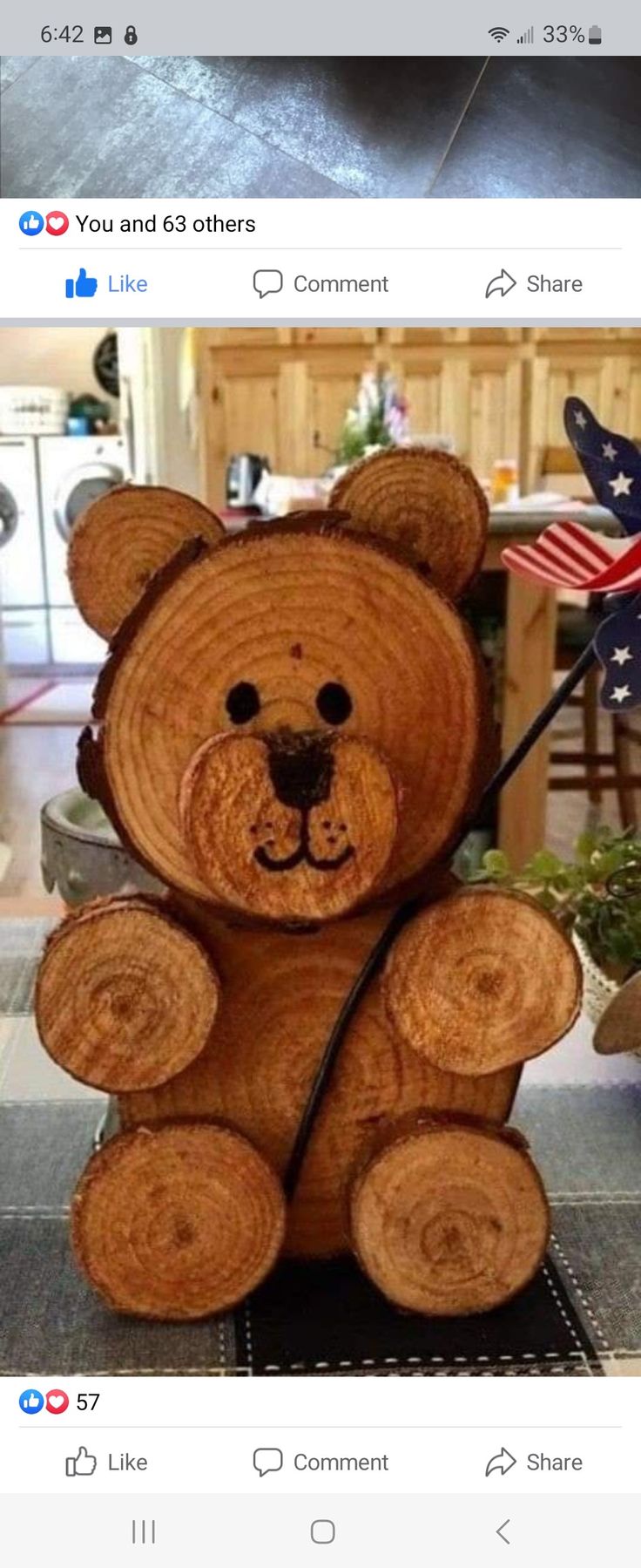 a teddy bear made out of wood with an american flag on it's back