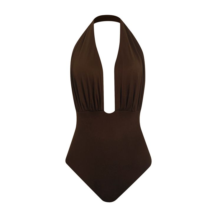 The Rosalie One-Piece Swimsuit features a plunging neckline, double-layered ruching details at the bust for secure coverage, and a high-waisted, double-layered bottom with strong shaping power for a slimming effect along the waistline and the hip.  Made from Amni Soul Eco®, the world’s first biodegradable polyamide from Italy, the garment is sustainably made in Brazil.  Details & Care: Pull-on style Fully Lined   90% Amni Soul Eco polyamide, 10% spandex Hand wash cold Dry in shade Do not tumble Brown Fitted V-neck Swimwear, Fitted Brown V-neck Swimwear, Elegant Lined Triangle Top Swimwear, Chic Lined Halter Neck Swimwear, Elegant Ruched Backless Swimwear, Elegant Brown Swimwear, Brown Backless Beachwear Swimwear, Brown One-piece Swimwear For Party, Brown Backless Swimwear For Swimming