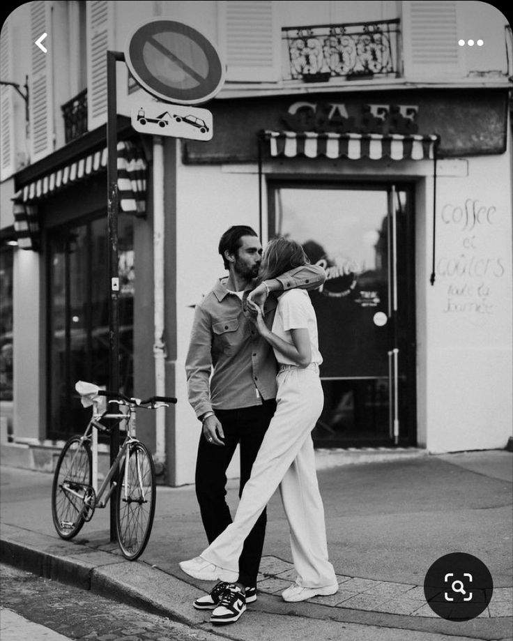 a man and woman walking down the street