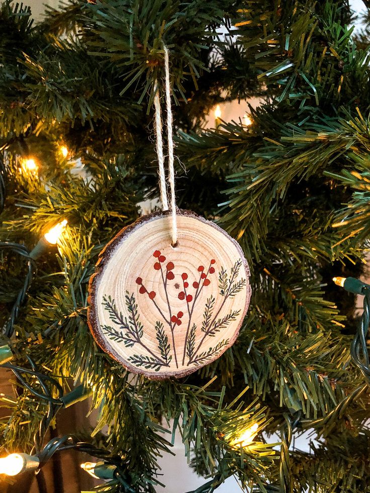 a wooden ornament hanging from a christmas tree