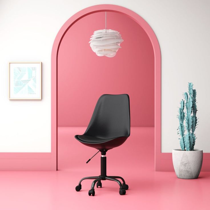 a black office chair sitting on top of a pink floor next to a potted cactus