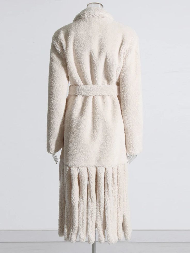 With its cozy fringe detailing, this fashionable coat is perfect for any cold-weather looks. Material: Faux Fur, polyester, cotton Closure Type: Belt Cozy Fringe Outerwear For Fall, Chic Winter Fringe Outerwear, Chic Fall Outerwear With Tassels, Cozy Long Sleeve Outerwear With Fringe, Chic Beige Outerwear With Fringe, Chic Beige Fringe Outerwear, Winter Outerwear With Tassels And Long Sleeves, Beige Fringed Winter Outerwear, Winter Long Sleeve Outerwear With Tassels