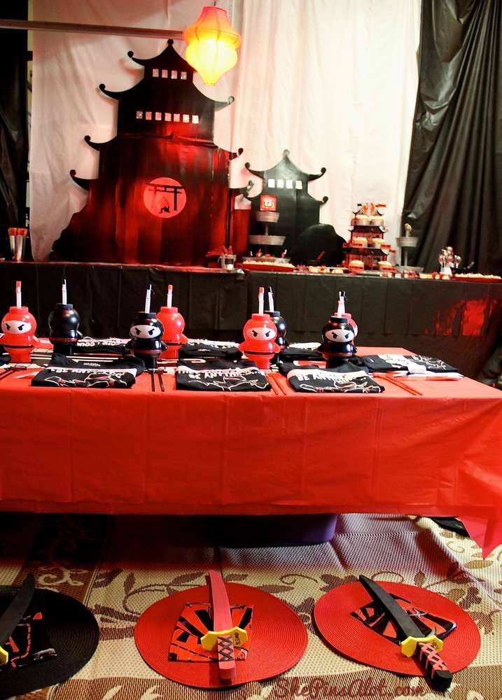 a red table topped with lots of cake