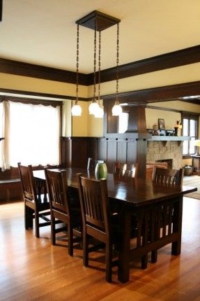 a large dining room table and chairs with wood flooring