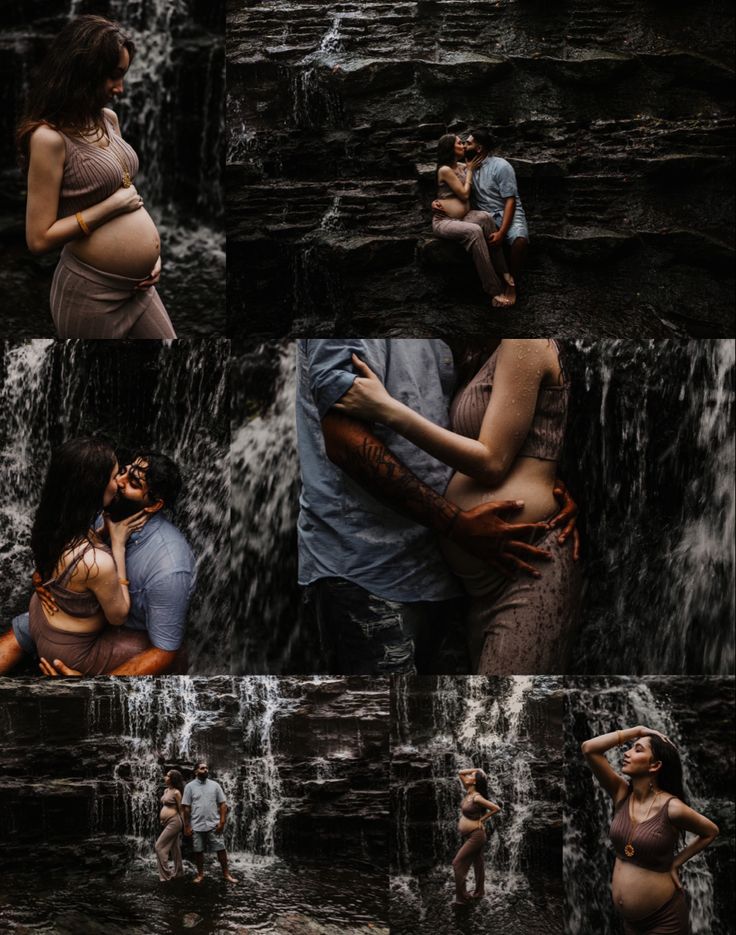 a pregnant couple cuddles in front of a waterfall while holding each other and kissing