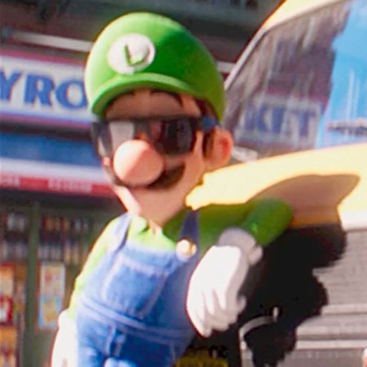 a man in overalls and a green hat holding a skateboard