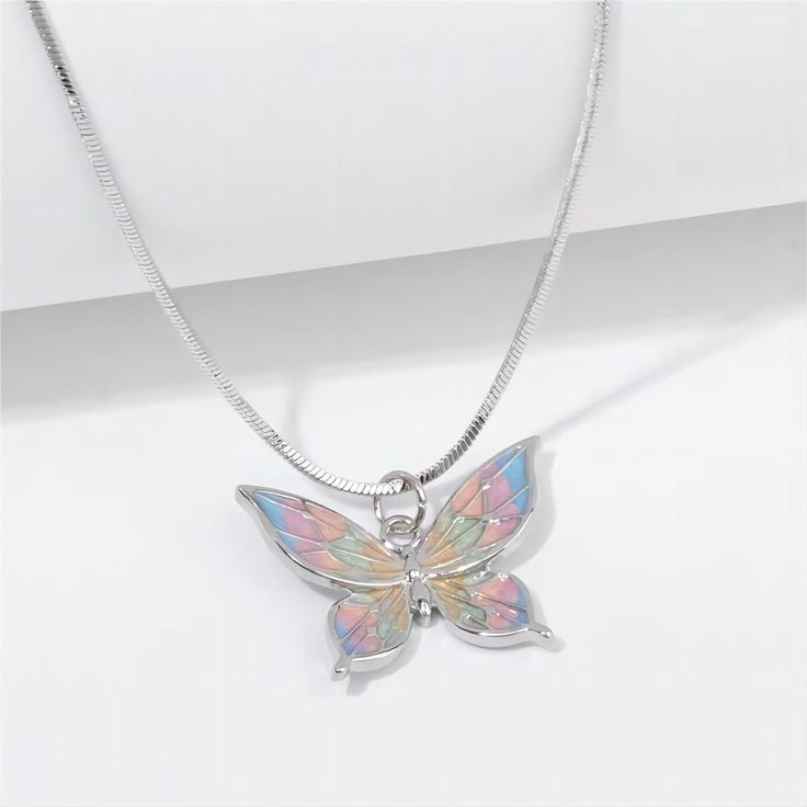 Description:Enamel Butterfly NecklaceSpecifications:Material: copper, enamel, silverColors: SilverSize: 40 cm + 5 cm extWeight: 6 g/pc Upgrade your style with our Enamel Butterfly Necklace. With a charming design and playful colors, this necklace will add a touch of whimsy to any outfit. Stand out with this unique accessory and make a statement without saying a word! Butterfly Chain Necklace, Butterfly Chain, Playful Colors, Enamel Butterfly, Handmade Butterfly, Color Butterfly, Delicate Butterfly, Butterfly Pendant Necklace, Wedding Banquet