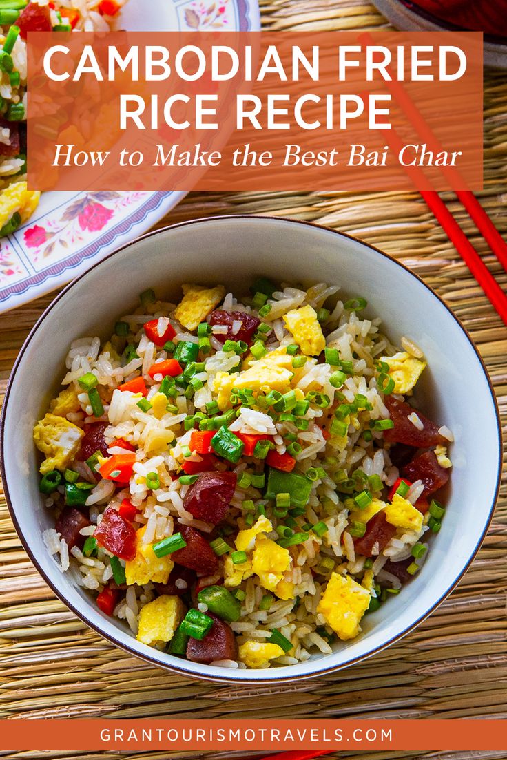 a bowl filled with rice and vegetables on top of a table next to chopsticks