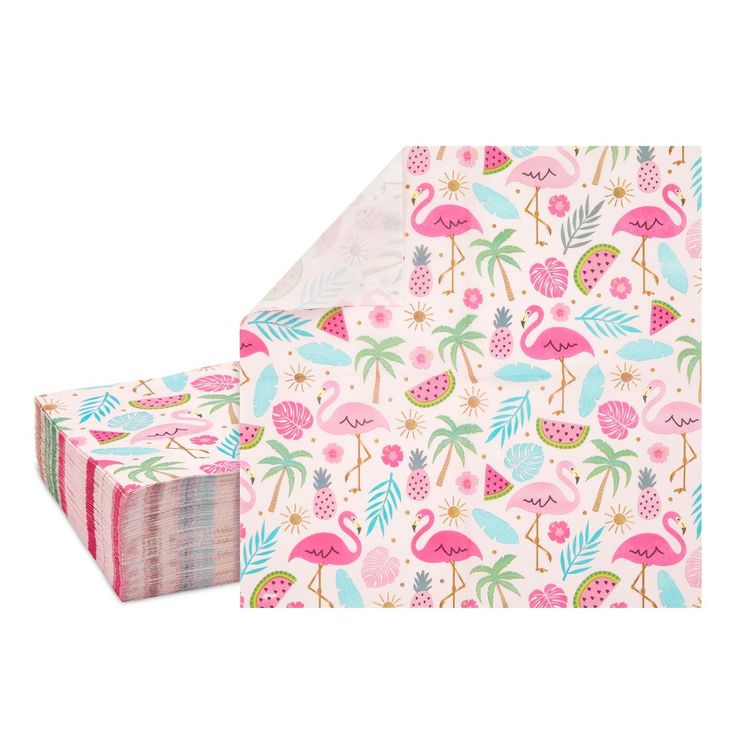 pink flamingos and pineapples are on the side of a paper gift box