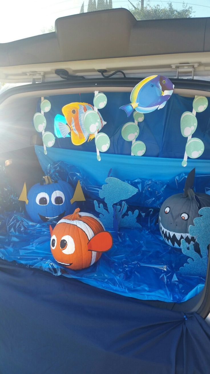 an inflatable car seat with fish and sea creatures on the back, under it