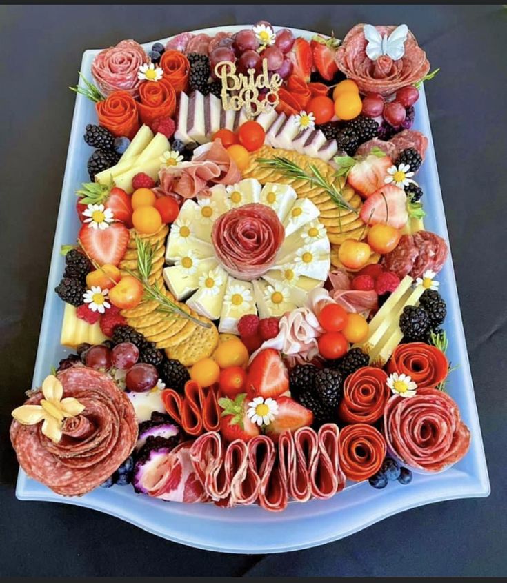 a platter filled with lots of different types of food