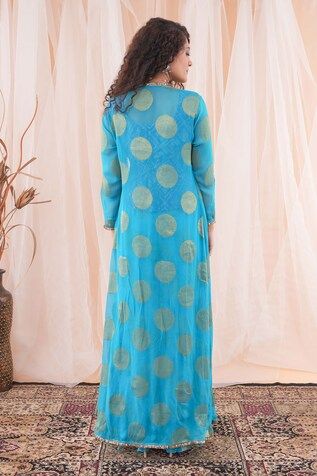 Peacock blue banarasi georgette long shrug with circular motifs embroidery. Comes with sharara and an ink blue banarasi brocade top with cutdana hand work. - Aza Fashions Blue Long Sleeve Kurta With Gota Work, Long Sleeve Gota Work Choli For Eid, Long Sleeve Choli With Gota Work For Eid, Blue Long Sleeve Anarkali Set With Cutdana, Festive Long Sleeve Dresses With Gota Work, Chanderi Sets With Gota Work And Long Sleeves, Long Sleeve Chanderi Palazzo Set With Pallu, Festival Gota Work Palazzo Set With Long Sleeves, Festival Long Sleeve Palazzo Set With Gota Work