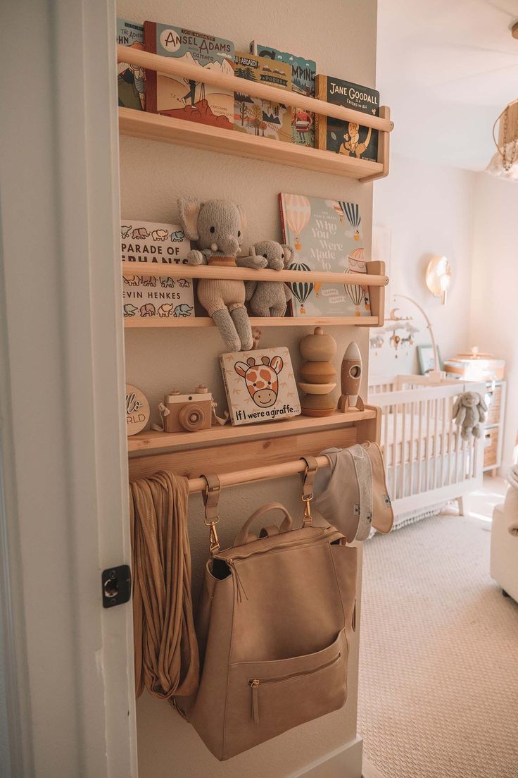 a baby's room is shown with toys and books on the shelves, including a purse