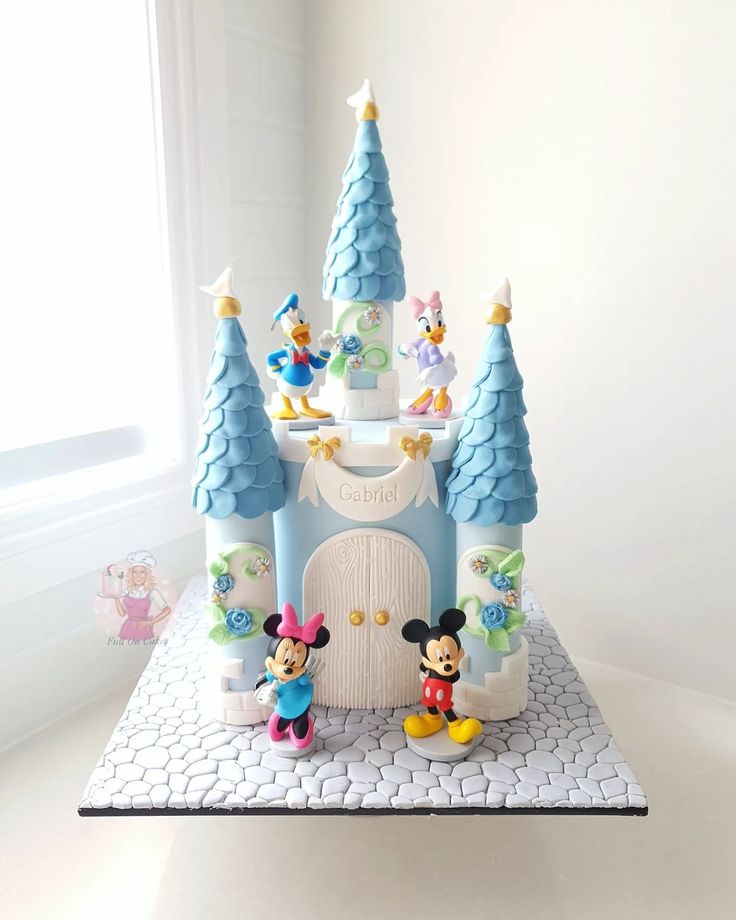 a cake that looks like mickey mouse's castle