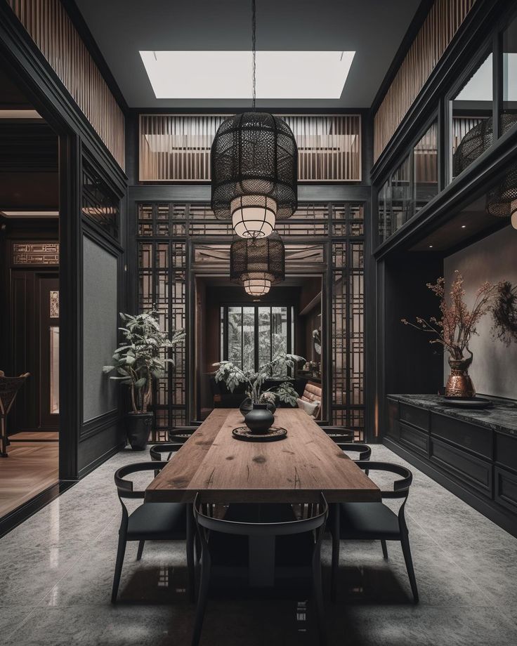 a dining room table surrounded by chairs and potted plants