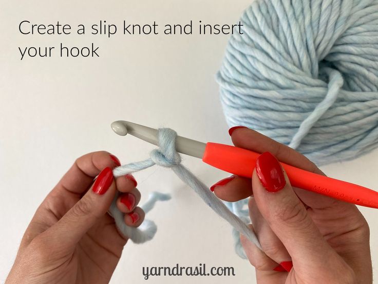 someone crocheting together yarn and knitting needles with text overlay that reads, tighten the slip knot to fit snugly around the hook