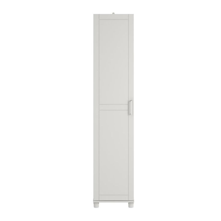 a tall white cabinet sitting on top of a white floor next to a wall mounted toilet