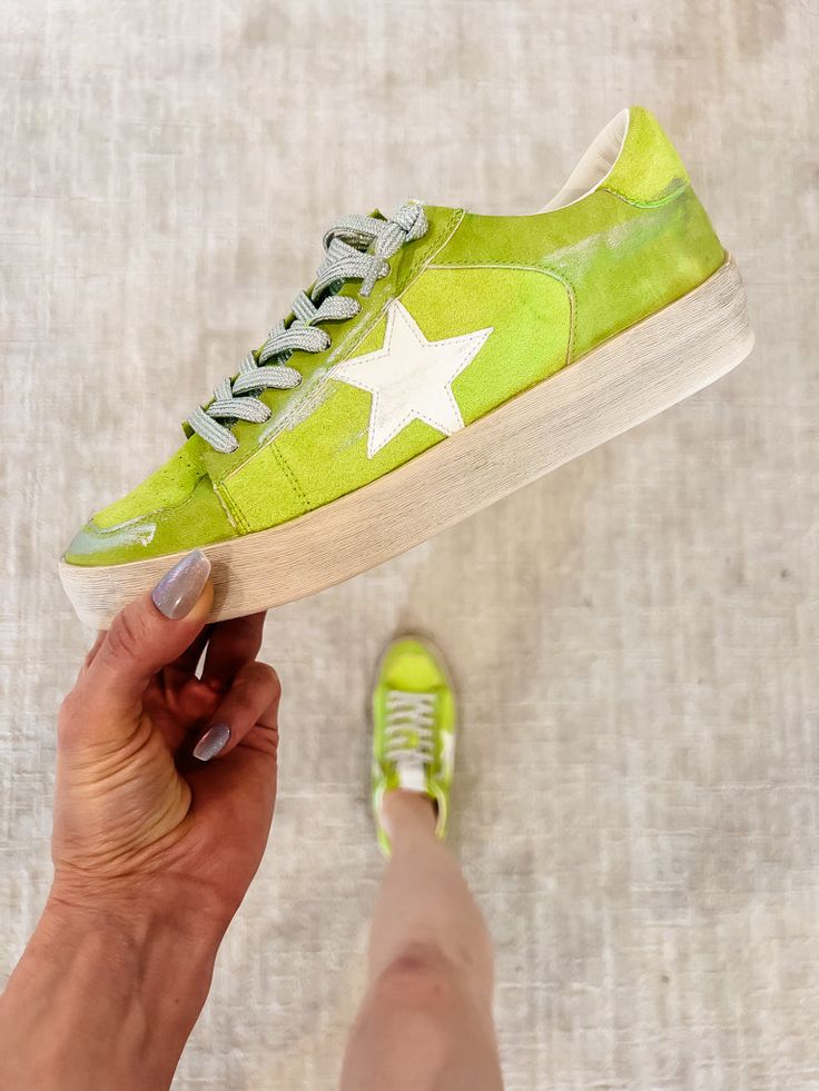 Women's Sequined Star Print Lace Up Tennis Shoes Candace Sneakers, Chartreuse Step into the spotlight with our lace-up Candace sneakers in chartreuse, boasting a glamorous gold sequin heel and enchanting stars motif. These sneakers are the epitome of style and comfort, designed to captivate attention wherever you go. Whether you're stepping out for a casual outing or hitting the town for a night of fun, our Candace sneakers ensure you shine bright with their vibrant color and irresistible sparkl Green Lace-up Platform Sneakers For Spring, Spring Green Lace-up Platform Sneakers, Green Platform Sneakers With Vulcanized Sole For Spring, Trendy Green Platform Sneakers With Laces, Green Low-top Summer Sneakers, Green Spring Sneakers With Perforated Toe Box, Spring Green Sneakers With Perforated Toe Box, Green Sneakers With Perforated Toe Box For Spring, Bright Sneakers