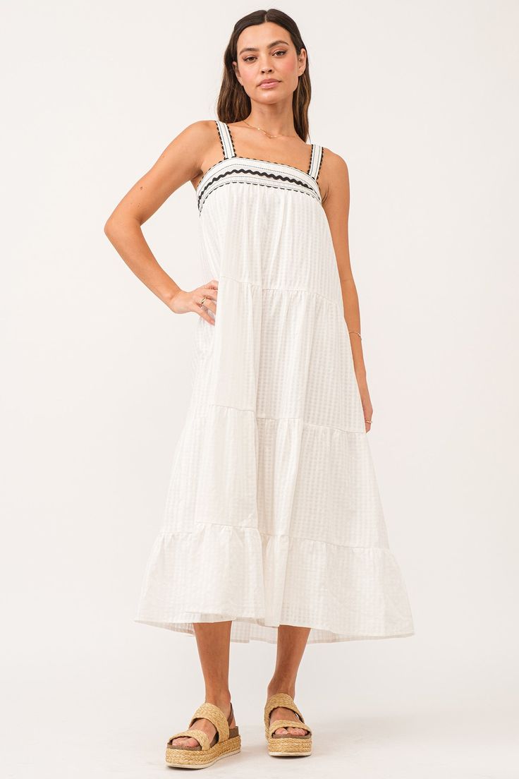 Ruched lace strap midi dress in gingham plaid, halter front finish with embroidered front & smocked back yoke, tiered skirt. Multi color woven on relaxed fit. Harmonious fusion of plaid & sophistication, culminates in an embroidered flourish with effortless grace!Body length from HPS: 49", Strap width: 7/8", Bust: 35" (Size Small) 100% COTTON Machine wash cold, Tumble dry low Imported White Tiered Skirt Dress With Adjustable Straps, Summer Cotton Smocked Dress With Lace Trim, Summer Daywear Smocked Dress With Lace Trim, Summer Gingham Dress With Tiered Skirt, White Midi Dress With Smocked Bodice And Spaghetti Straps, Summer Smocked Dress With Lace Trim For Daywear, White Midi Dress With Spaghetti Straps And Smocked Bodice, Spring Cotton Smocked Dress With Adjustable Straps, Casual Summer Smocked Dress With Lace Trim