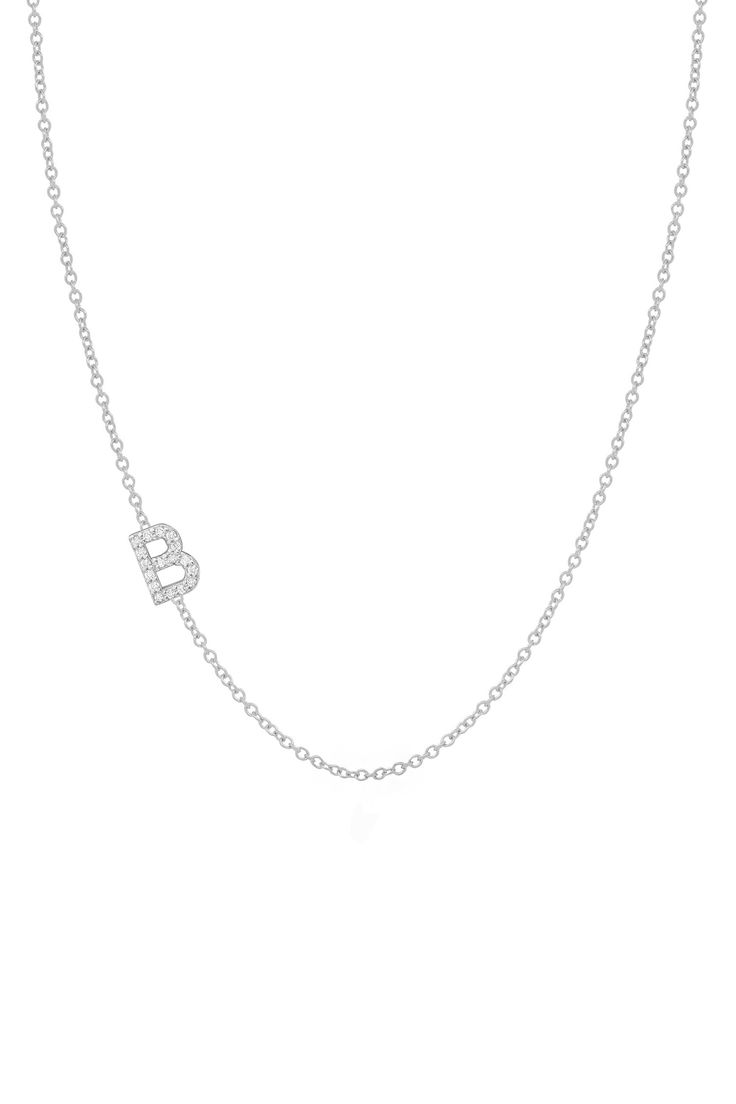 Slightly off-kilter and we love it. For those who like to color outside the lines and bend the rules, this style is for you. Mark your milestone with this sweet little diamond initial letter offered in three luxurious metals. Whether layered or worn alone, there's nothing conventional about this necklace so go on, indulge a little... Also available in 14K Yellow. No refunds or exchanges. Once an order is placed, it cannot be canceled. Expected shipping in 3-4 weeks. Dainty Diamond Initial Necklace In White Gold, Dainty White Gold Diamond Initial Necklace, Diamond Initial Necklace In White Gold, Silver Dainty Diamond Initial Pendant Necklace, Dainty White Gold Diamond Initial Pendant Necklace, Minimalist Silver Diamond Initial Pendant Necklace, Dainty White Gold Diamond Necklace With Initial Pendant, White Gold Initials Necklace In Fine Jewelry Style, White Gold Initial Pendant Necklace With Diamond Accents