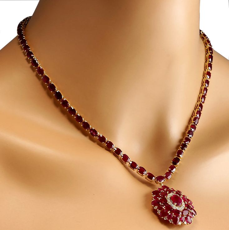 Stamped: 14K Yellow Gold Total Necklace Weight: 24.3 Grams Necklace Length: 17 Inches Gemstone Weight: Total Natural Center Ruby Weight is 1.66 Carat (Measures: 9.00x6.85 mm) Color: Red Gemstone Weight: Total Natural Side Ruby Weight is 51.02 Carat Color: Red Diamond Weight: Total Natural Diamond Weight is 1.00 Carat Quantity: 34 Color: F-G, Clarity: VS2-SI1 Face Measures: 32.70x29.40 mm Sku: [702600W] Luxury Ruby Necklace With Brilliant Cut, Dazzling Ruby Gemstone Necklaces, Formal Round Diamond Necklace With Gemstones, Formal Red Diamond Necklace With 17 Jewels, Formal Ruby Diamond Necklace With Brilliant Cut, Fine Jewelry Yellow Gold Necklace Aaa Quality, Exquisite Round Ruby Necklaces, Formal Ruby Gemstone Necklaces, Formal Ruby Gemstone Necklace