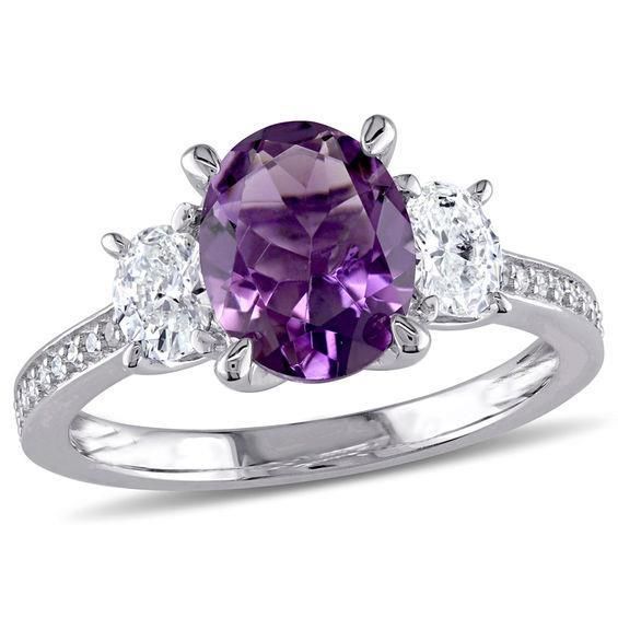 METAL SPECIFICATIONS Metal Name: White Gold 14K STONE SPECIFICATIONS Stone Name: AMETHYST/DIAMOND Stone Cut : Oval and Round Stone Specifications: There is one amethyst in the center of approx. 10.00 carats & approx. 1.50 carats of small diamonds on the side. Natural earth-mined stones. Total Stone Weight: approx. 11.50 carats Color : Dark purple/F Clarity : AAA/VVS1 RING SPECIFICATIONS Appraised Value : $1225 0.00 Comes with a FREE APPRAISAL Ring Size : 6.5 (Can ship in any size you want) All k Jewellery Wardrobe, Diamond Three Stone Ring, Bracelet Tennis, Amethyst And Diamond Ring, 3 Stone Engagement Rings, Flower Engagement Ring, Three Stone Ring, Sapphire Engagement Ring Blue, Bright Purple