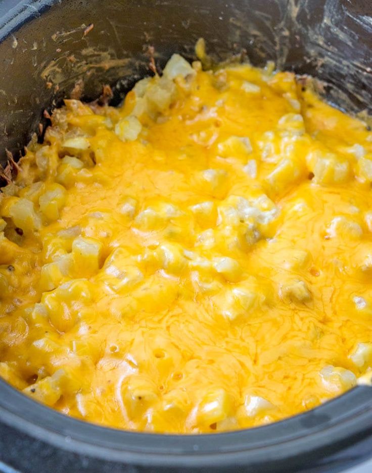 a crock pot filled with macaroni and cheese