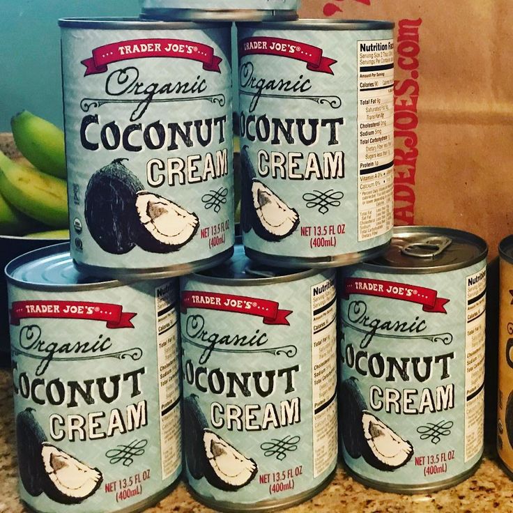 six cans of coconut cream sitting on top of a counter