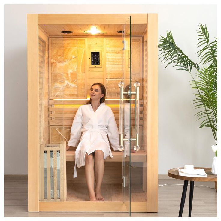 a woman sitting in a sauna