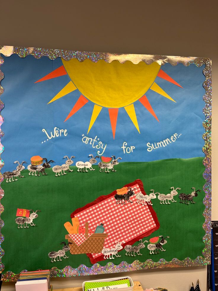 a bulletin board with an image of a picnic scene and the words, we're early for summer