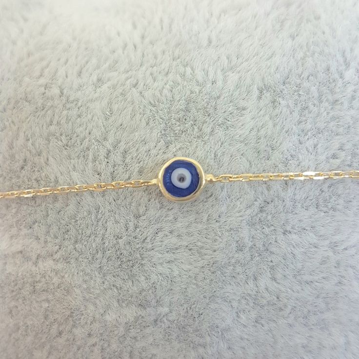 - Evil Eye Single Bracelet is made with high quality 14K real solid yellow gold. - Evil Eye Single Bracelet for women decorateded with two different color enamel options, navy blue and turquoise. Its length is 7 inches( We can shorten it, please contact with us). The diameter of the round evil eye is 6 mm. - This Evil Eye Single Bracelet is also available as a necklace. And there are trio evil eye models on our listings. - This cute, charm, dainty, delicate, elegant, trendy women jewelry 14K Rea Elegant Blue Chain Bracelet As Gift, Elegant Blue Chain Bracelet For Gift, Dainty Blue Bangle Jewelry, Dainty Blue Bangle, Blue Adjustable Chain Bracelet, Blue Hypoallergenic Charm Bracelet For Gift, Hypoallergenic Blue Charm Bracelet Gift, Dainty Blue Bracelet With Adjustable Chain, Elegant Blue Bracelets With Adjustable Chain