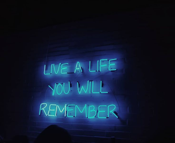 a neon sign that says live a life you will remember