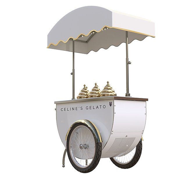 an ice cream cart with wheels and awning