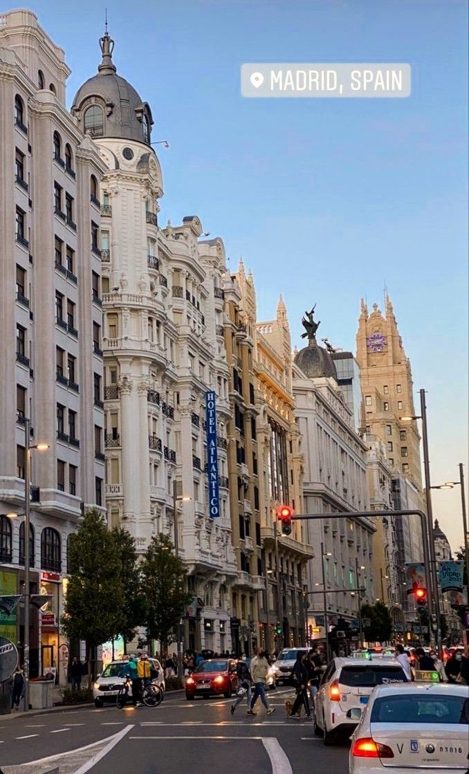 a city street filled with traffic and tall buildings