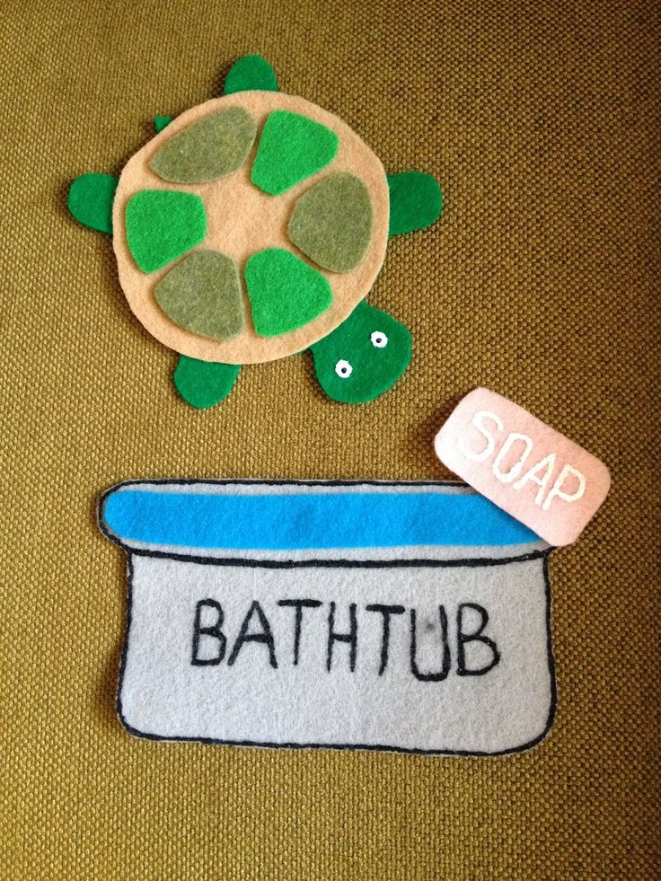 a bathtub with a turtle and soap on it sitting next to a tag that says soap