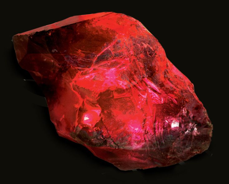 a red rock on a black background